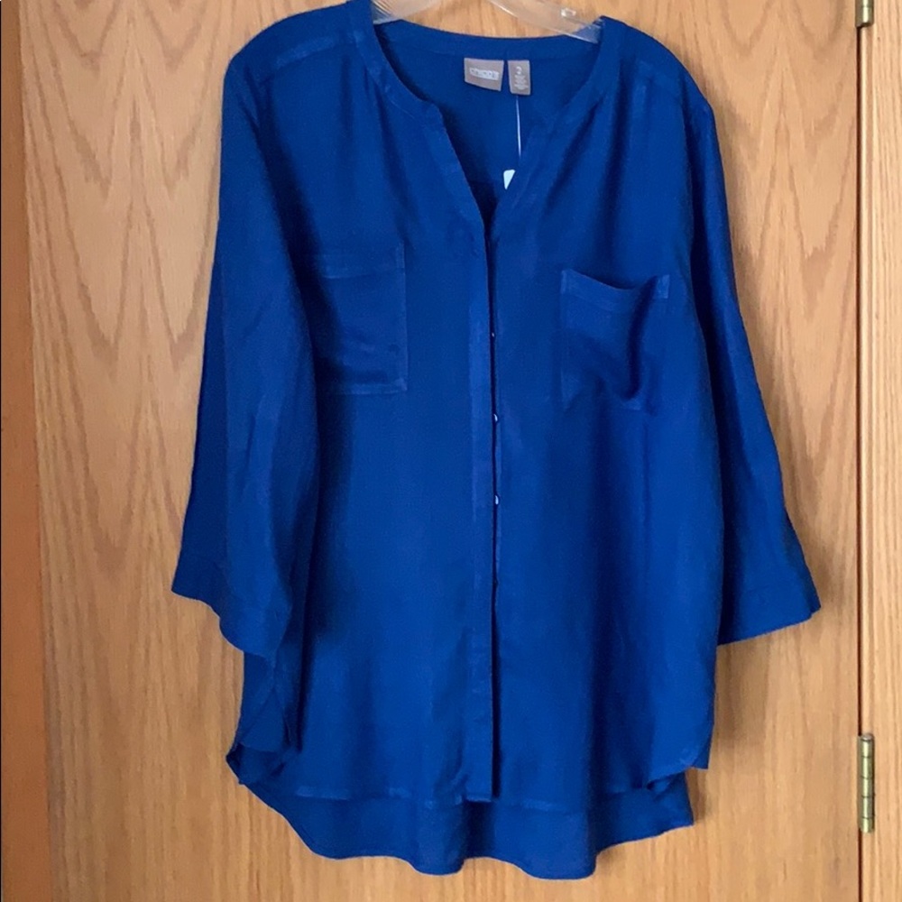 Blue button down, two pockets, 3/4 sleeves.